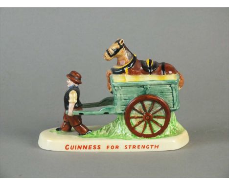 A Carlton Ware Guinness advertising group circa 1950s modelled as a cart horse resting in a wagon pulled by a drayman and ins