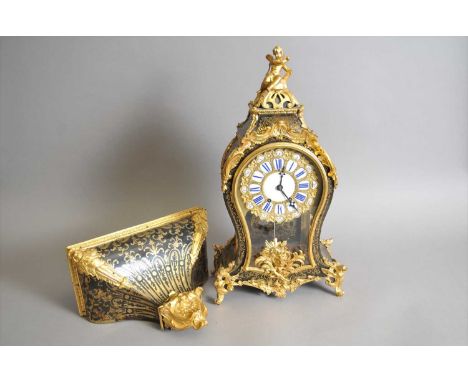 A French Louis XV style boulle type marquetry mantel clock, the backplate unsigned, numbered 992, the cushion enamel and gilt