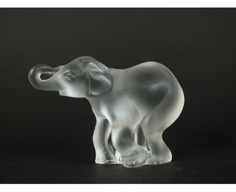 A Lalique Crystal model of Elephant post-war the frosted glass modelled standing with trunk raised, etched 'Lalique France', 