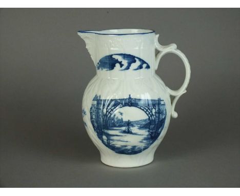 A Caughley maskhead cabbage-leaf moulded jug dated 1790 named to 'Mr. Berridge', transfer-printed in underglaze blue with a v