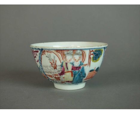 A Worcester tea bowl circa 1760 decorated in the Chinese export style, painted in underglaze blue and overpainted enamels wit