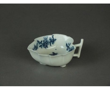 A Worcester geranium leaf butter boat circa 1770 transfer-printed in underglaze blue with floral sprigs, with angular stalk h
