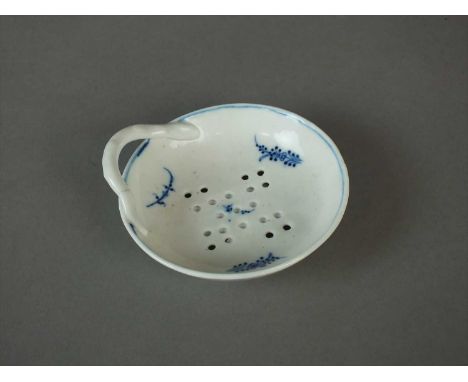 A Caughley egg drainer circa 1785 of circular form with single-handle, the pierced bowl painted with light blue floral sprigs