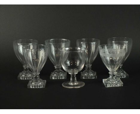A set of five glass rummers, early 19th century, the ogee bowls decorated with vertical bands of dots, set on square 'lemon s