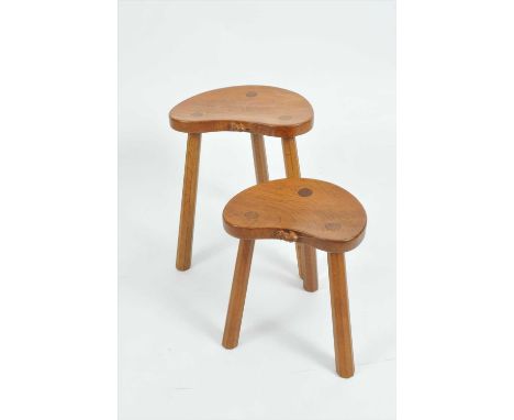 Robert 'Mouseman' Thompson, an associated mid oak 'cow' and 'calf' stool, the graduating pair both with kidney shaped tops, e