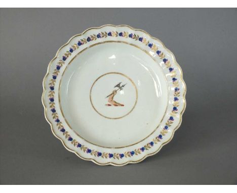 A Caughley polychrome armorial plate circa 1790 of circular form with fluted border, centrally painted with armorial crest of