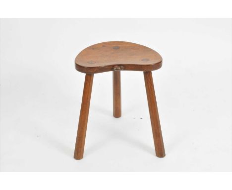 Robert 'Mouseman' Thompson, an oak cow stool, the kidney shaped seat with a carved mouse signature to the seat (middle border