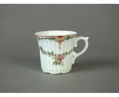 An early Worcester reeded coffee can circa 1753-54 the small, flared cup moulded with corrugated flutes, the rim and foot bot