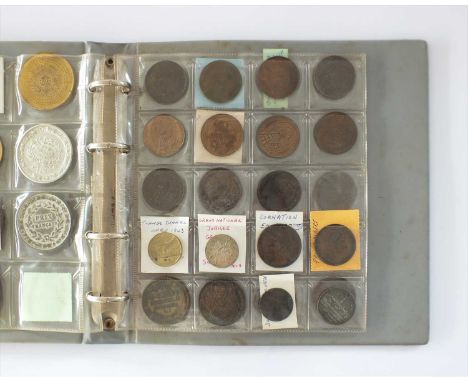 An album containing fourty-seven British and French assorted white metal, copper and bronze medallions