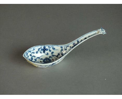 A Worcester rice spoon circa 1765-70 the handle with floral terminal, painted in blue with the 'Maltese Cross' pattern, cresc