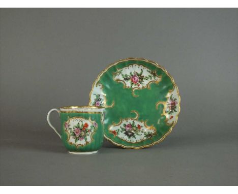 A Worcester coffee cup and saucer circa 1770 of fluted form, painted with panels of floral bouquets in polychrome reserved ag