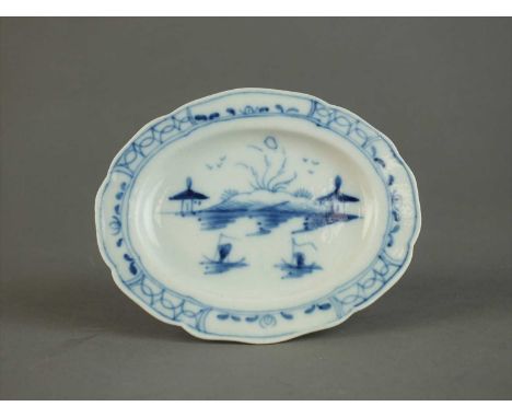 A Caughley toy dinner plate circa 1780-90 painted in bright blue with the Island pattern with associated segmented border to 