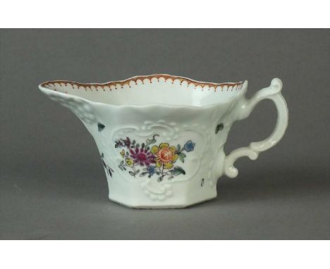 A Worcester hexagonal creamboat circa 1762 the double scroll handle moulded with a circular boss at each terminal, the spout 