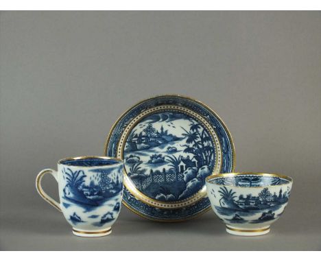 A Caughley trio of coffee cup and saucer circa 1780-90 of plain form with loop handle, transfer-printed in underglaze blue wi