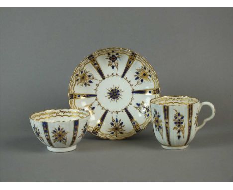 A Caughley polychrome coffee cup, teabowl and saucer circa 1790 of fluted form with ear-shaped handle, painted with the 'Roya
