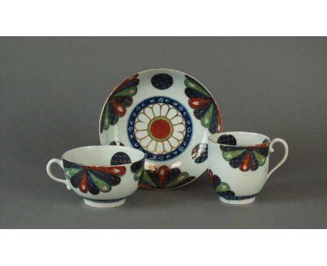 A Worcester trio of teacup, coffee cup and saucer in the 'Japan Fan' pattern circa 1768-75 brightly decorated in the Imari pa