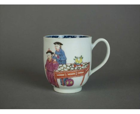 A Worcester 'Chinese Family' group coffee cup circa 1765 of plain form with indented loop handle, painted in polychrome with 