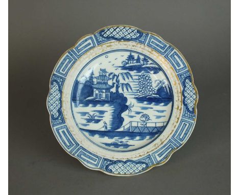 A Caughley 'Weir' pattern dessert plate circa 1785-93 of lobed, circular form, painted in underglaze blue with a single fishe