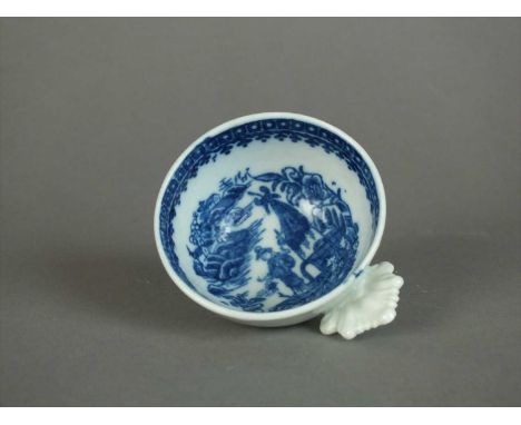 A Caughley wine taster or scoop circa 1785 of circular form with leaf-shaped handle, transfer-printed in underglaze blue with