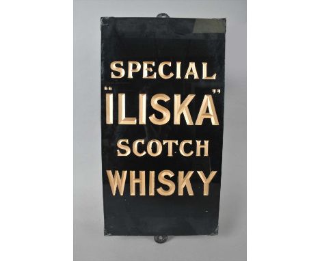 An original slate-backed glass advertising sign for 'Special "Iliska" Scotch Whisky', with bevelled gilded text, unmarked and