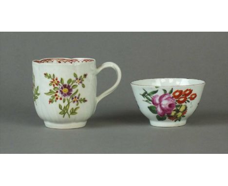 A Worcester tea bowl and coffee cup circa 1760 and 1780 the tea bowl with slightly everted lip edged in a brown enamel, paint