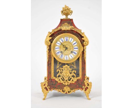A Leroy and Fitz (11935) boulle cased mantle clock. Complete with key and pendulum.
