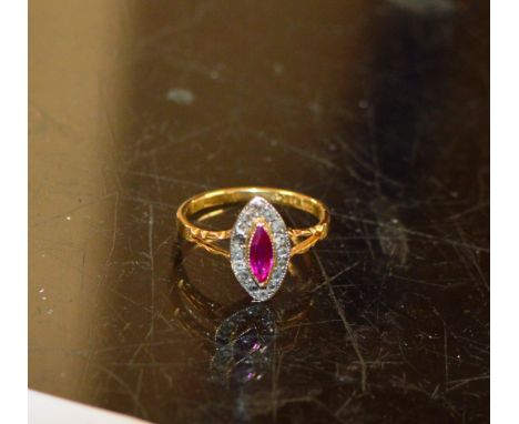 18 CARAT GOLD RING SET WITH A RUBY &amp; DIAMOND CHIP SURROUND - APPROXIMATE WEIGHT = 3 GRAMS     
