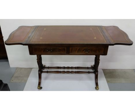 Mahogany Sofa Table, the top and two drop flaps covered with red leather and gold tooled borders, two apron drawers, on splay