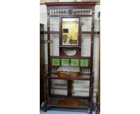 Edwardian Mahogany Hallstand with a stick stand tapered leg base, the reeded back rails having brass hooks and a bevelled mir