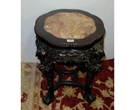 Victorian Chinese Hardwood Lamp Table, with a button detailed circular shaped top, inset with red marble, over heavily carved