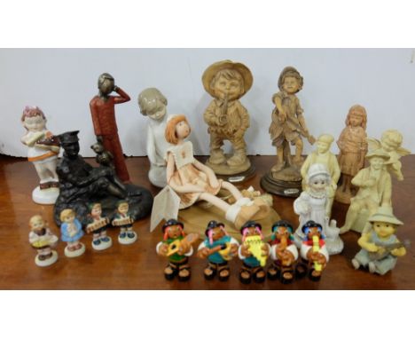 Shelf of ornaments – young girls and boys, musical figures etc