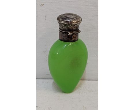 A 19th century uranium glass scent bottle having an engine turned silver hinged top, 10.5h, Location 