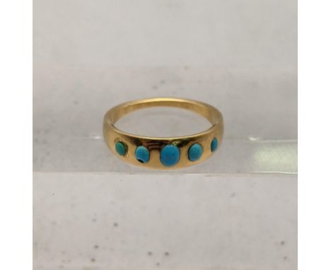 A yellow metal and turquoise ring tested as 18ct gold total weight 3.7gLocation: 