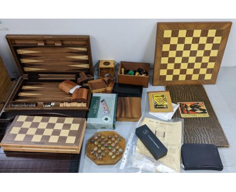 A selection of games to include a modern Jaques chess set with board, shove ha'penny, cribbage, Solitaire board with marbles 