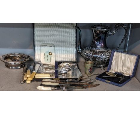 A mixed lot of silver plate and metalware items to include a silver plated teapot, wine coaster, christening set and mixed fl