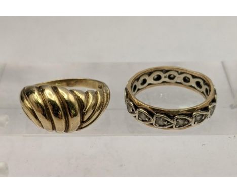 A 9ct gold croissant ring together with a yellow metal eternity ring with heart shaped sapphires total weight 9.9gLocation: 