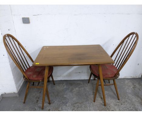 A mid-century Ercol breakfast table, model 393 circa 1960, in Golden Dawn colour with turned spindle undertier and elliptical