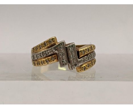 A platinum and 18ct gold ring set with diamonds, total weight 6.1gLocation: 