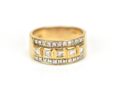 A 9ct gold and diamond dress ring, set with a central row of five bezel set princess cut diamonds, between a row of pave set 