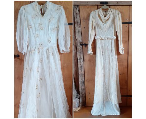 Two 1930's cream wedding dresses, one dress having an overlay of button mesh with cream leaf applique and gold coloured sequi