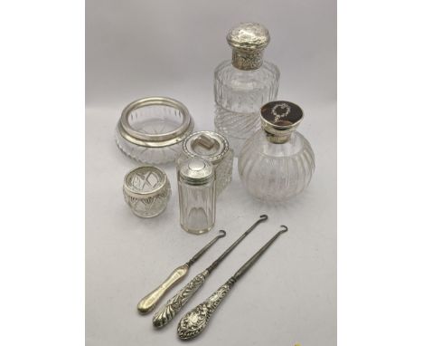 Silver topped and handled dressing table items to include two scent bottles, A/F, salt jar, button hooks, a jar and two rimme