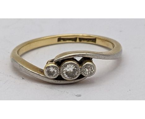An 18ct gold ring inset with three diamonds 2.1gLocation: 