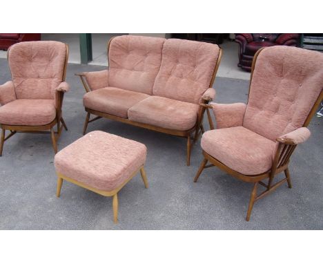 Ercol light beech framed four piece cottage suite comprising two seater settee, pair of armchairs and foot stool 