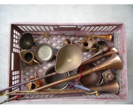 Box containing various copper and brass items including lamp, scales, ladle and hunting horns 