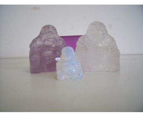 Carved amethyst Buddha, a similar quartz Buddha, etc 
