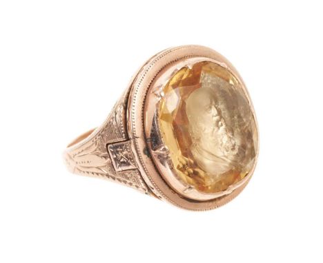 19th century gold and topaz/citrine poison ring with intaglio bezel, the foil-backed intaglio depicting a classical male bust
