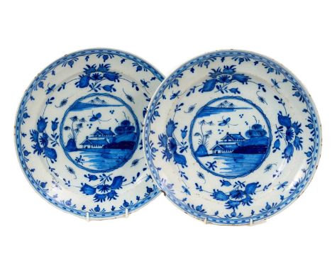 Pair of 18th century Dutch blue and white delftware dishes, painted in the Chinese style, 35cm diameterRim chips, glaze wear 