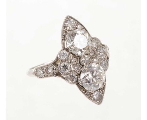 A fine Art Deco diamond cocktail ring, the marquise shape plaque with two principal old cut diamonds surrounded by further ol
