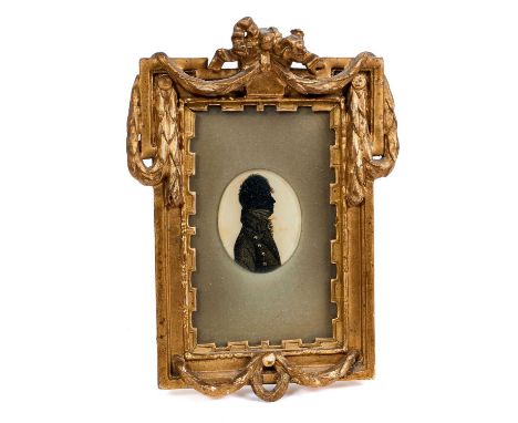 Early 19th century Continental portrait miniature, reverse painted on glass, depicting a gentleman in profile, oval, housed w