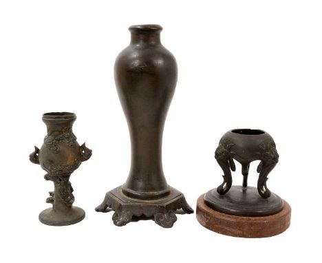 Chinese bronze baluster vase, of slender form on integral hexagonal plinth, 24cm high, and two other Oriental bronze vases. (